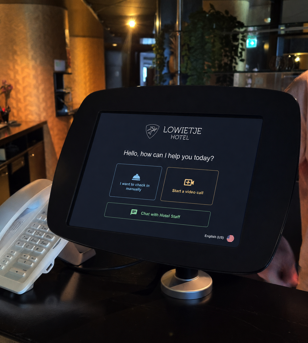 Guest using self check-in kiosk at hotel